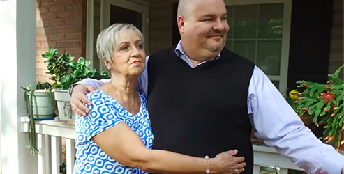 Angela, EMPLICITI® (elotuzumab) patient, with her caregiver